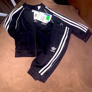 A black Adidas outfit 3 to 6 months brand new.